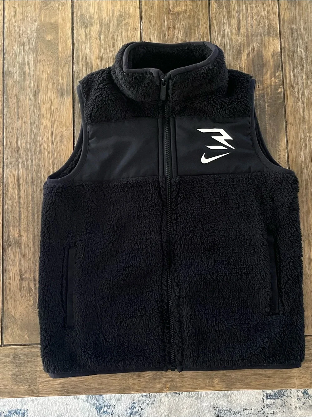 Nike Black Sherpa Fleece Kids Vest with White Logo size 8-9yrs